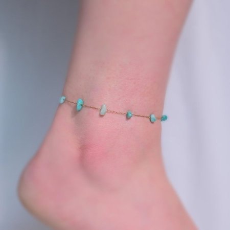 ذهبي مع حجر ازرق كبير