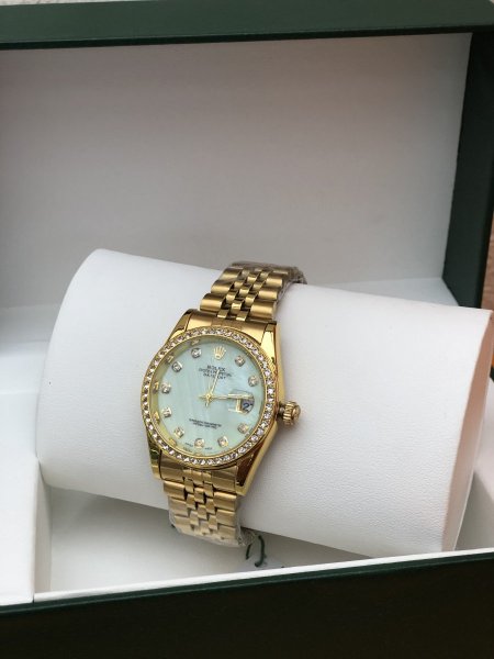 ساعة Rolex - ذهبي مع فيروزي <br> <span class='text-color-warm'>نفدت الكمية</span>