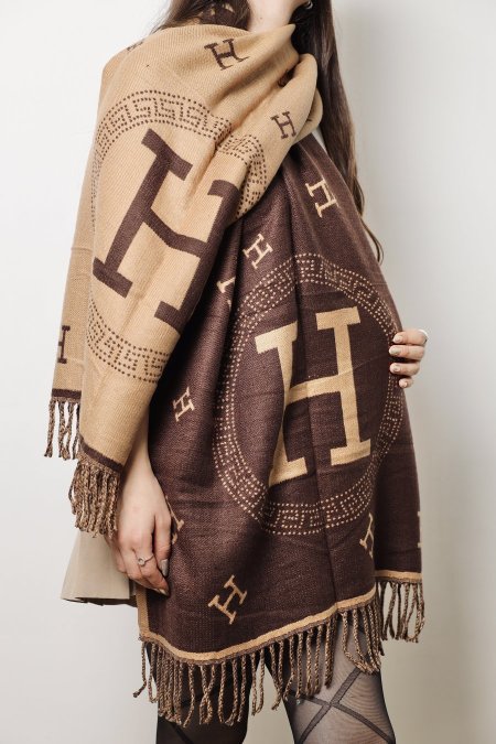 شعار مدور H / بني